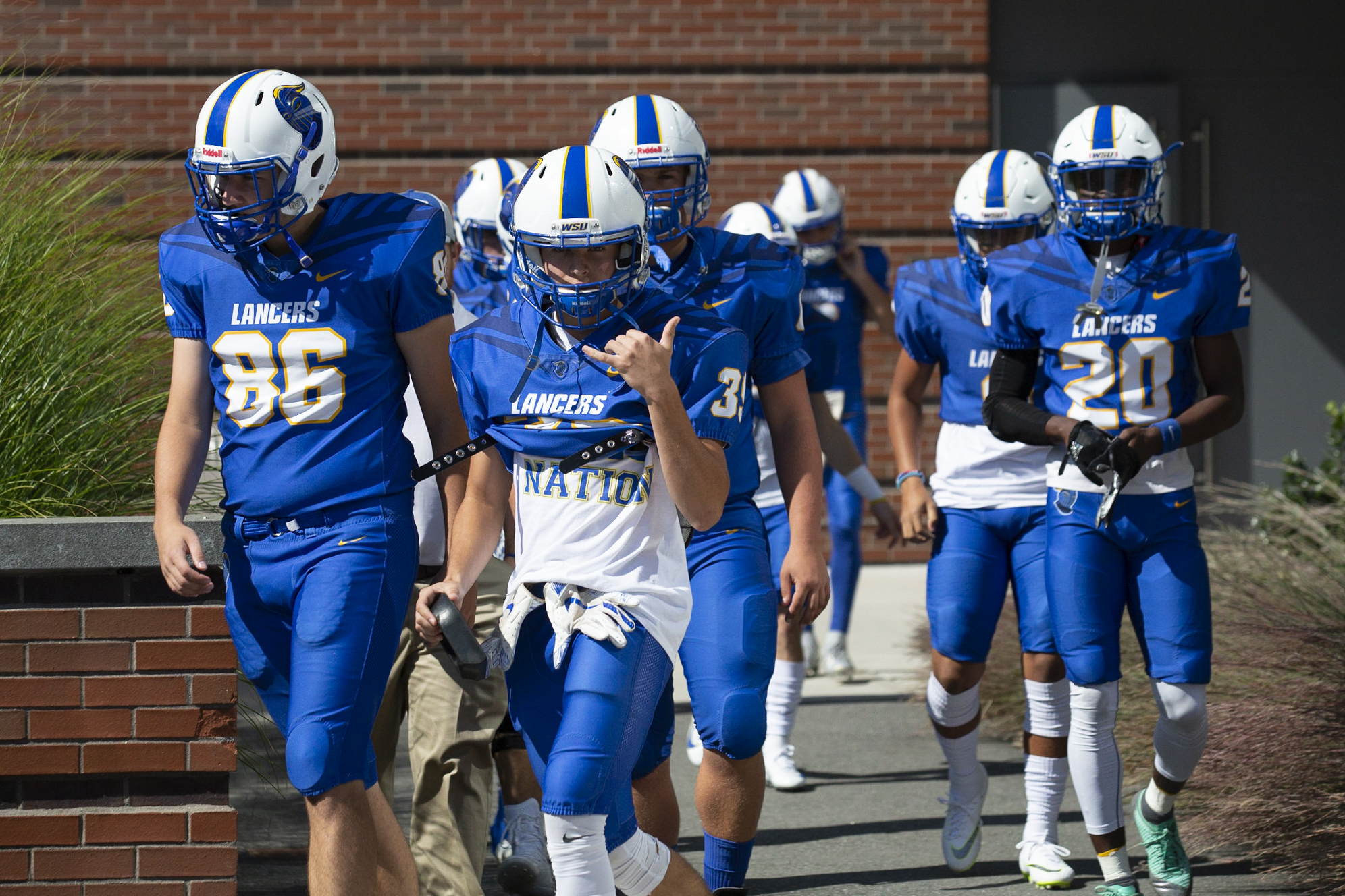 The Worcester State Football team walking on the football field before a game