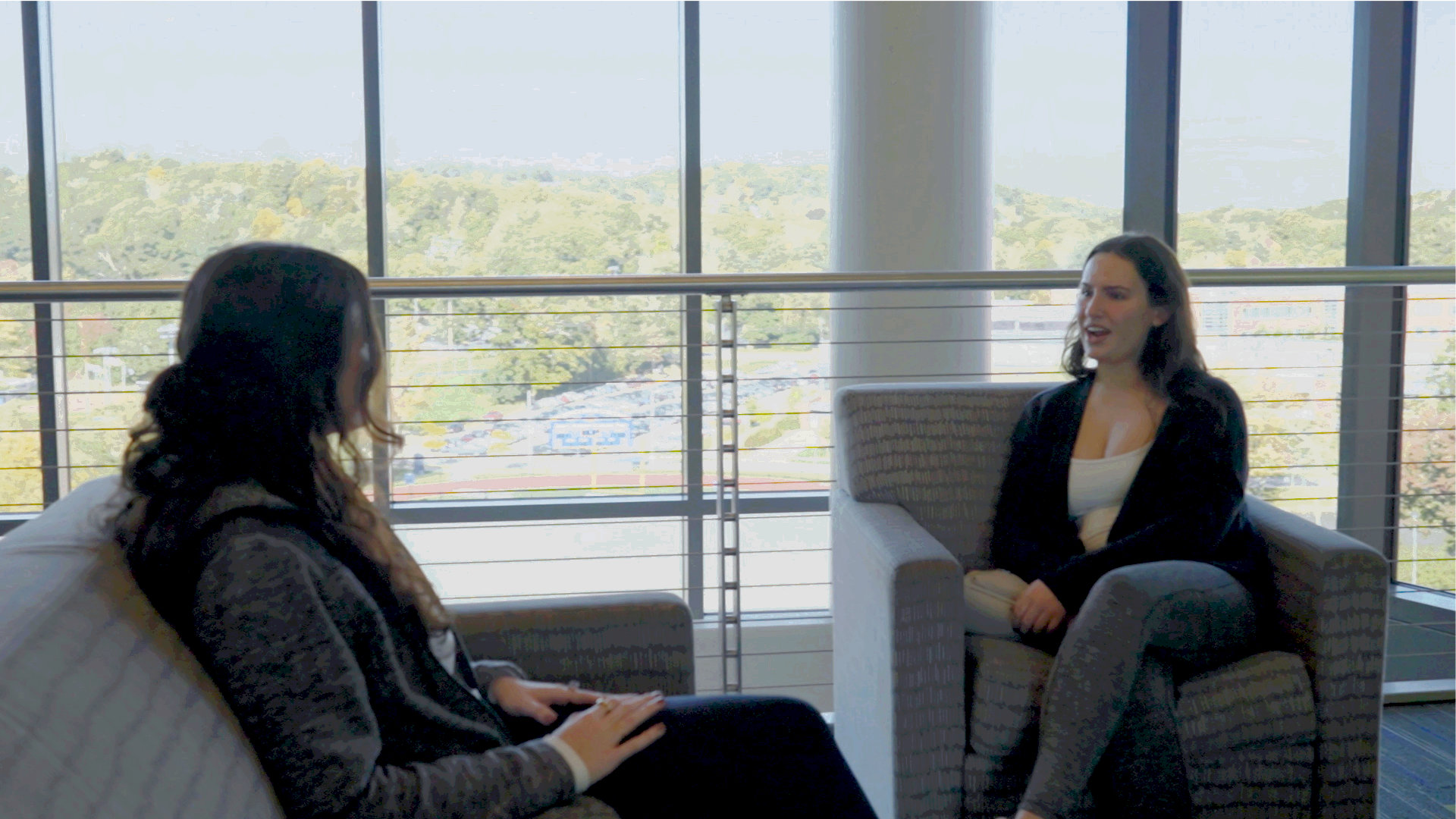 Two Worcester state students engaging in conversation in one of the lounges on campus