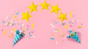 five stars with celebration cones and confetti