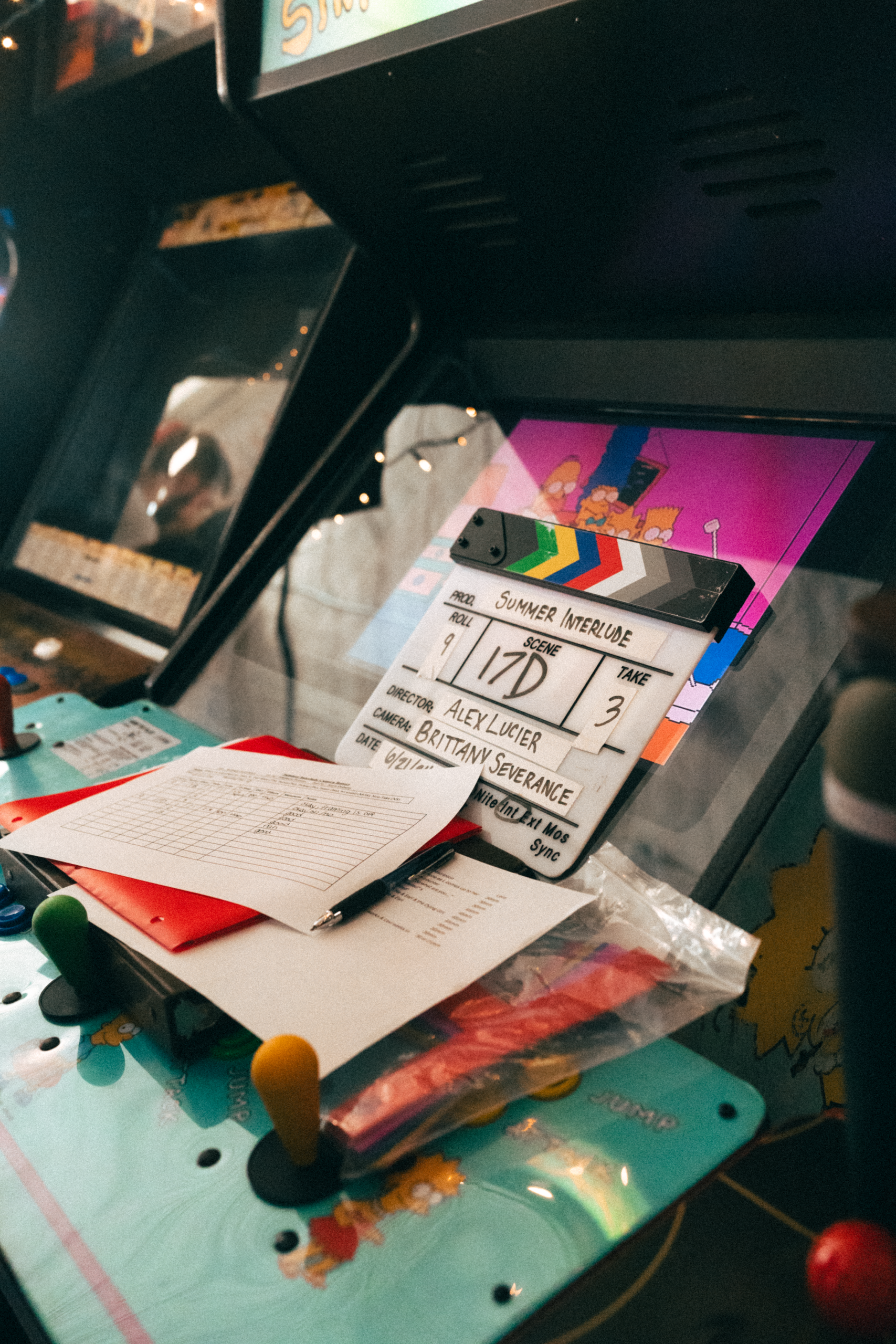 A close-up of folders, shot lists, and a slate that listed "Alex Lucier" as director and "Brittany Severance" as DP.