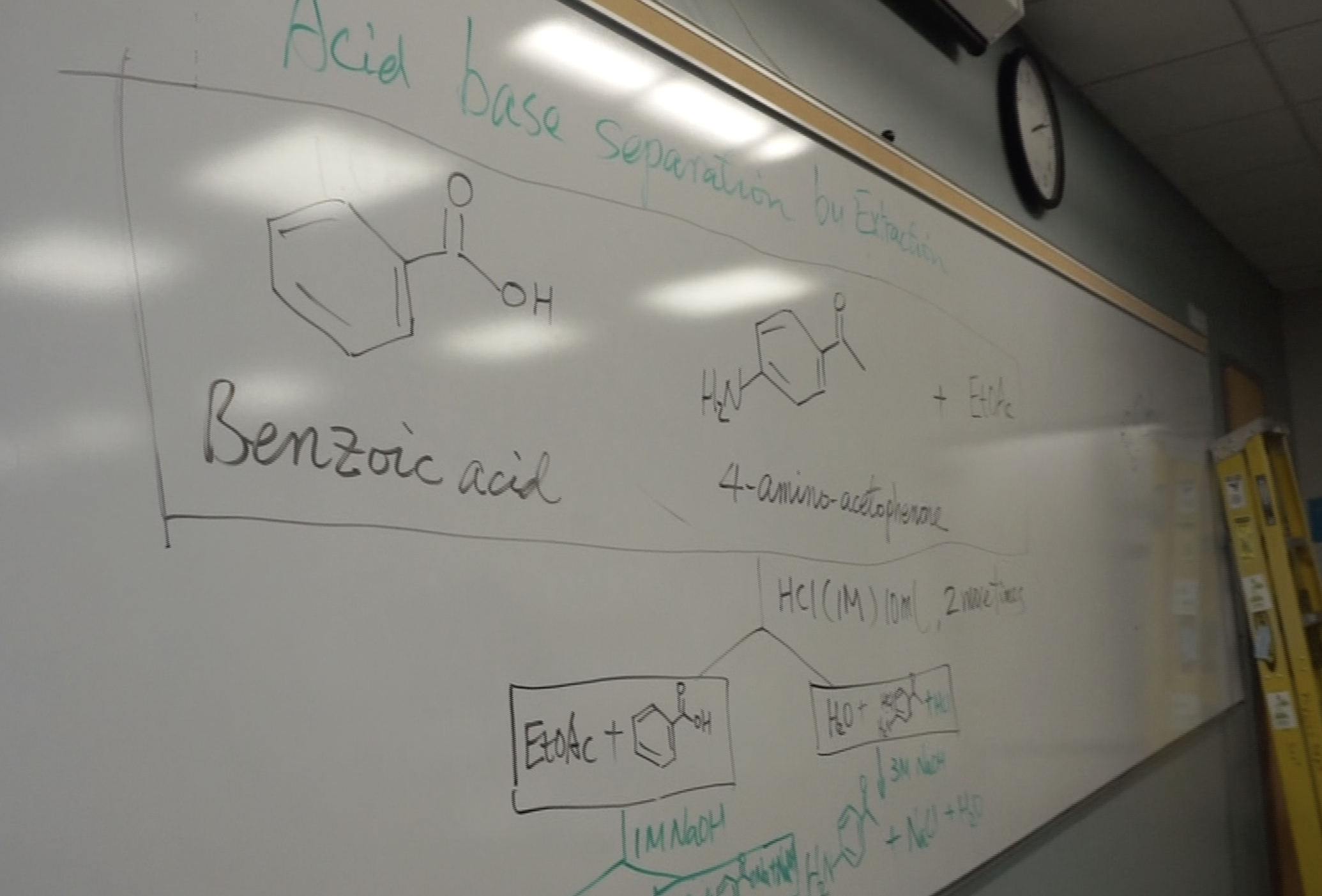 Whiteboard with chemical structures written on it