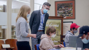 History faculty at Worcester state assist students doing archival work