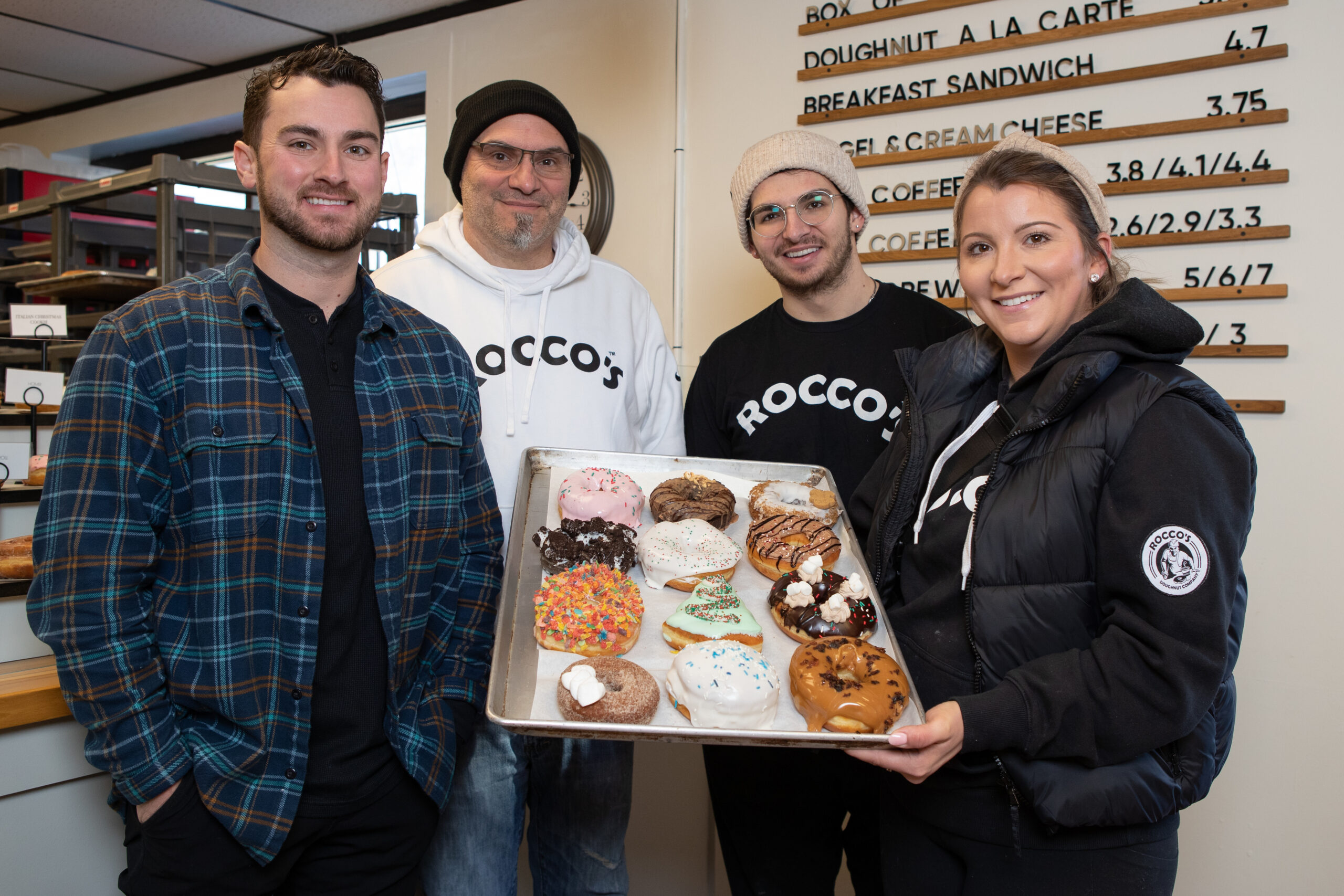 Joe Astrella, second from left, and his children Vicenzo, Domenic, and Lia are all part of the success of Rocco's Doughnuts