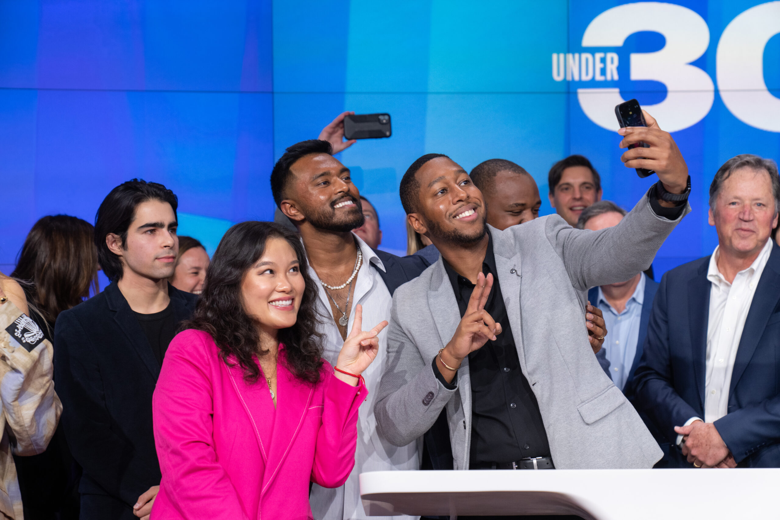 Derek Canton celebrates with fellow Forbes 30 Under 30 honorees in December by ringing the Nasdaq closing bell in Times Square