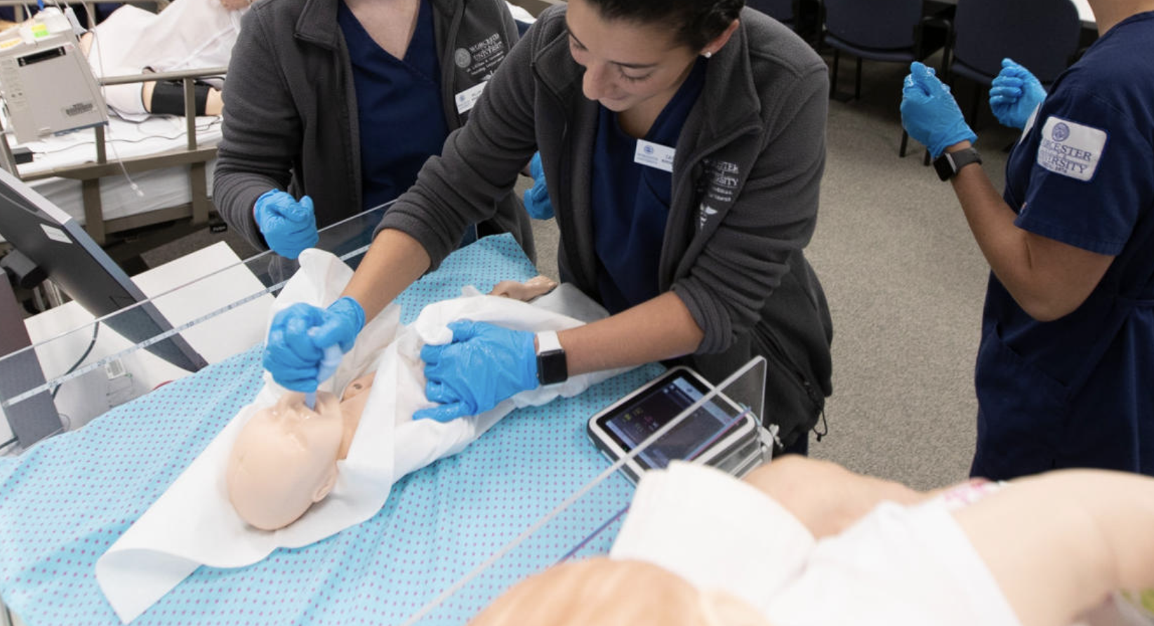 Nursing presentation in simulation lab, Nursing student feed oxogen to simulation baby