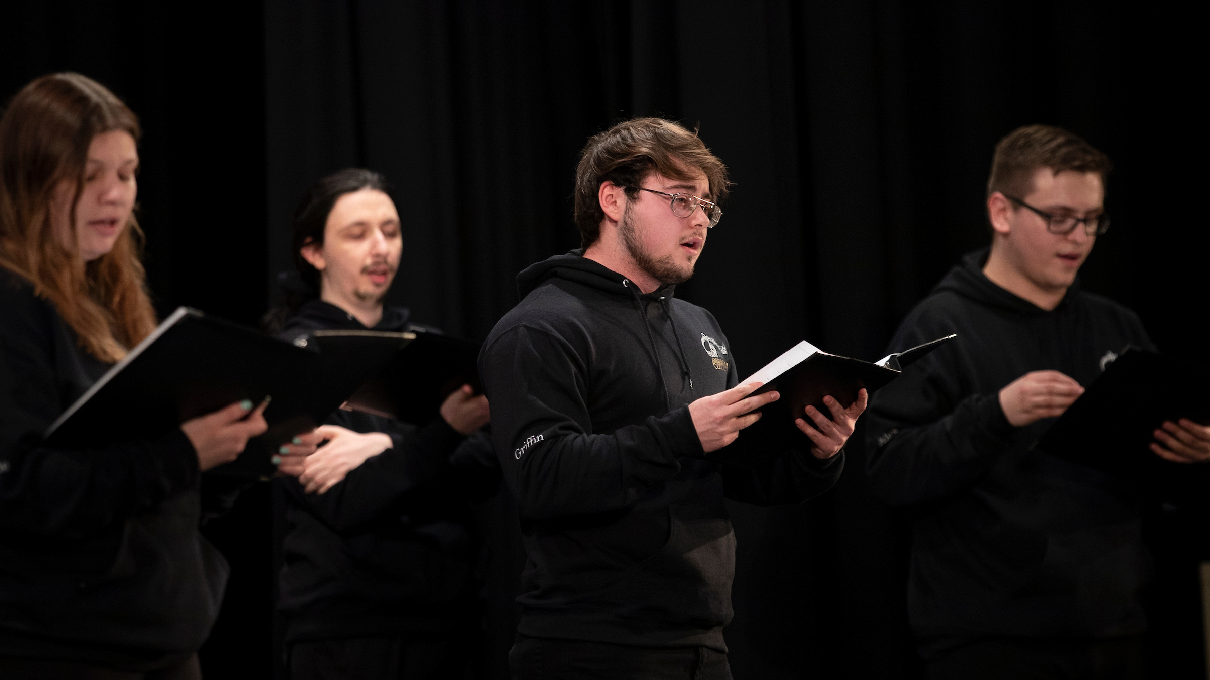 Worcester State University chorale members return to in-person performance in Sullivan Auditorium during the Spring 2022 Semester