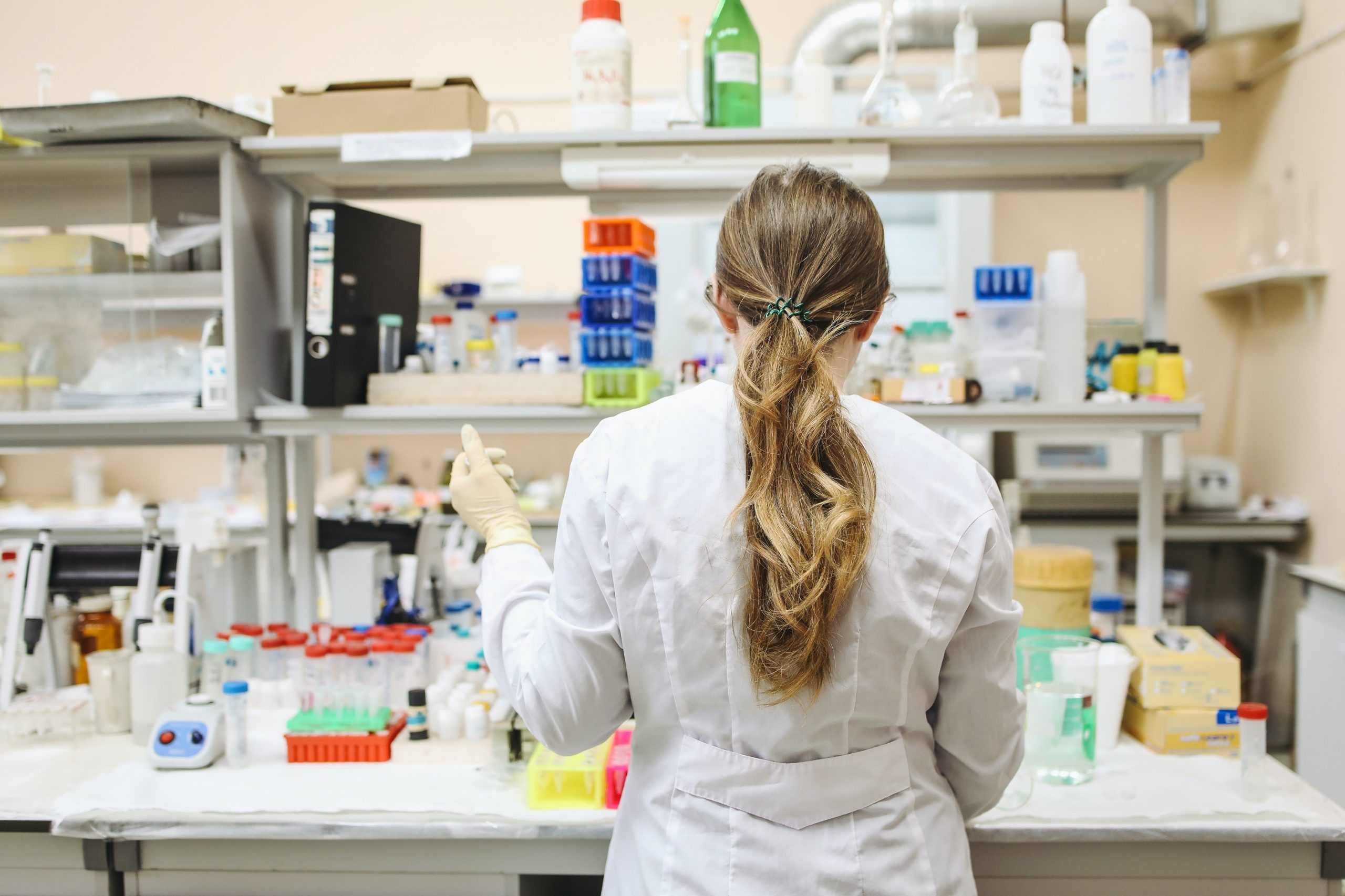 A student performing a science experiment in a lab