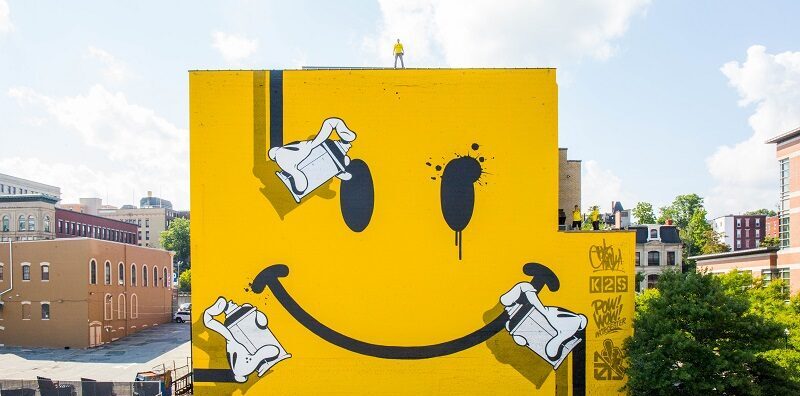 A mural of a smiley face in downtown Worcester
