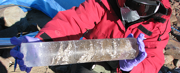 A student researching a piece of ice