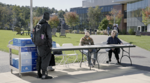 A student talking with members of the Career Service center on campus