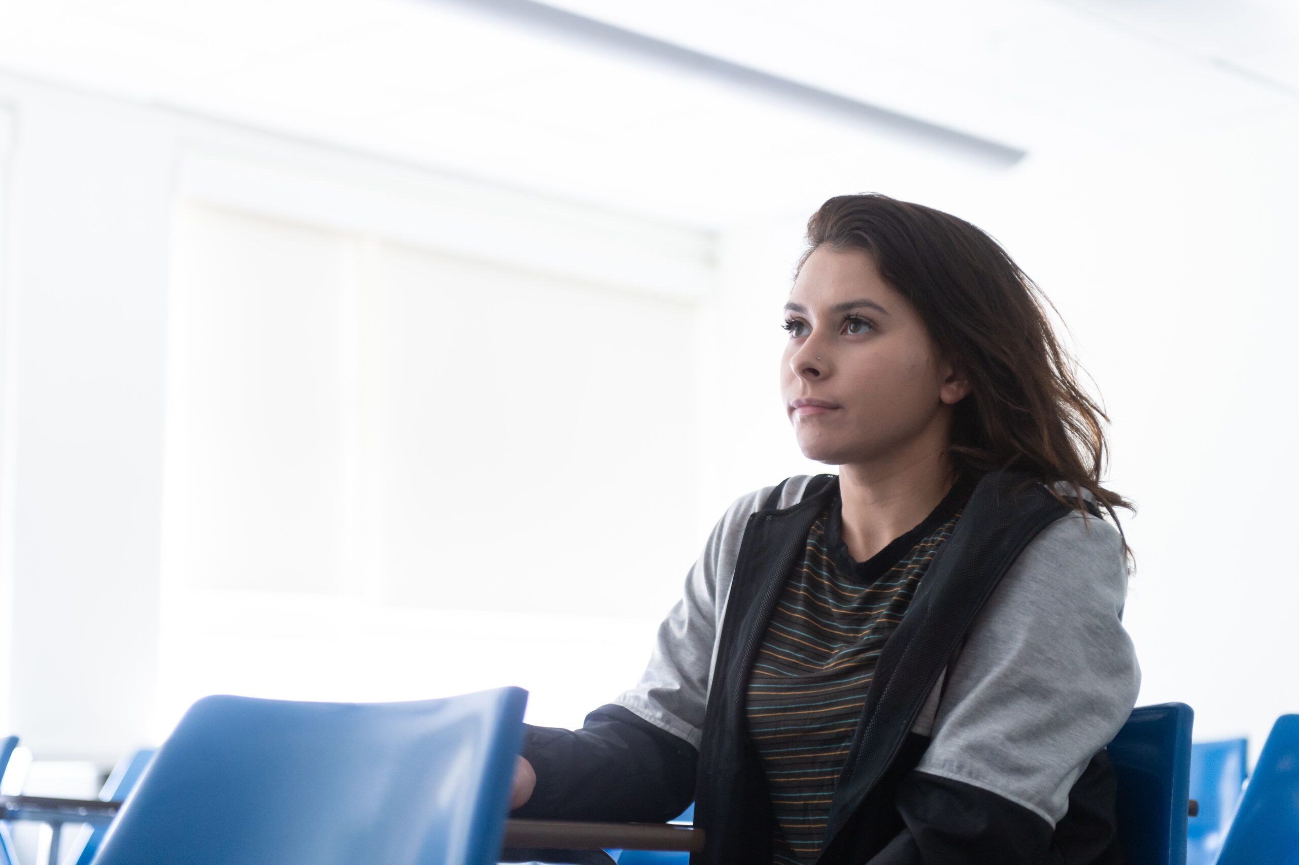 A student listening to a professor's lecture