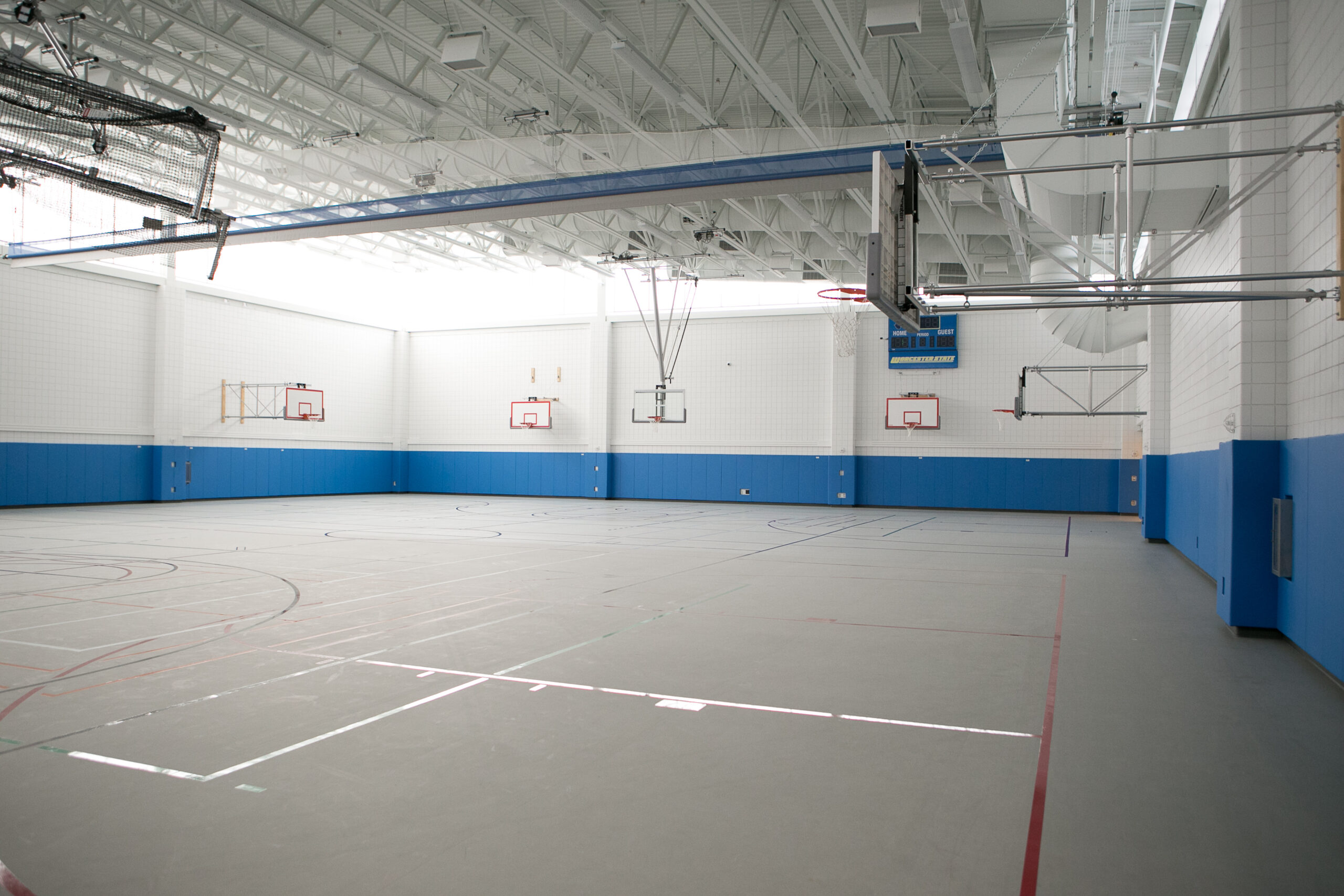 Empty practice basketball courts at Worcester State