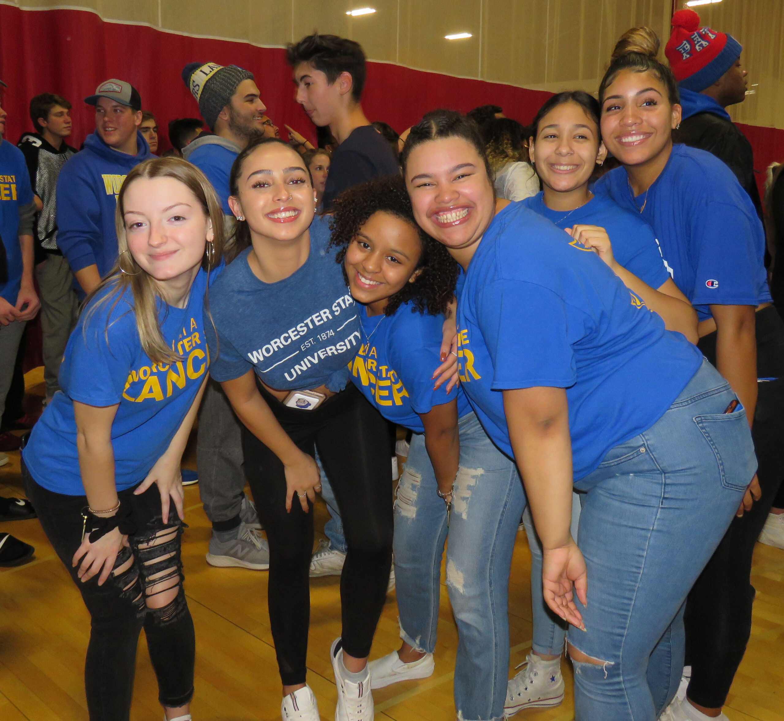 Worcester state students posting for a picture at Midnight Mayhem on Campus