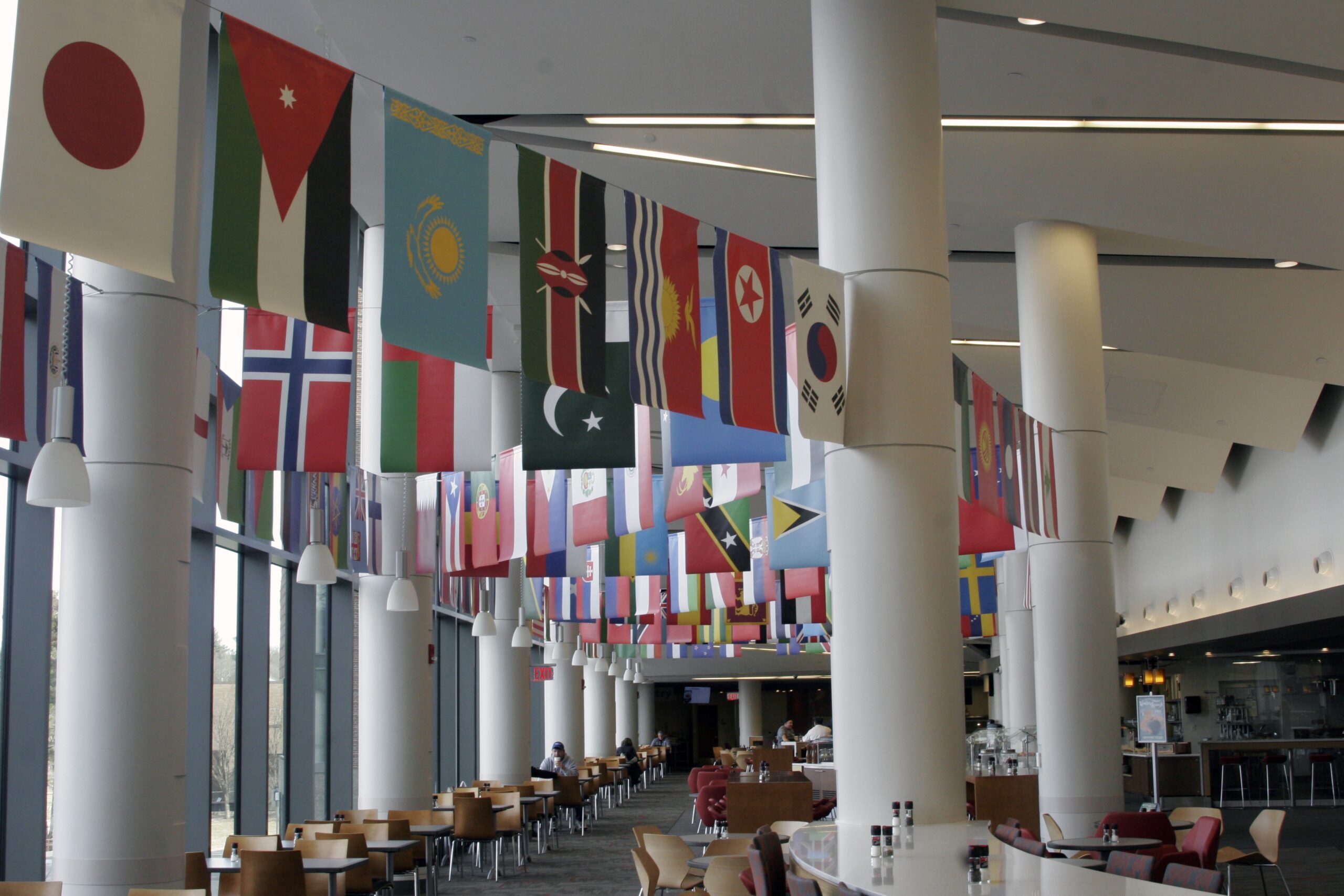 The Worcester state dinning hall where international flags hang from the ceiling