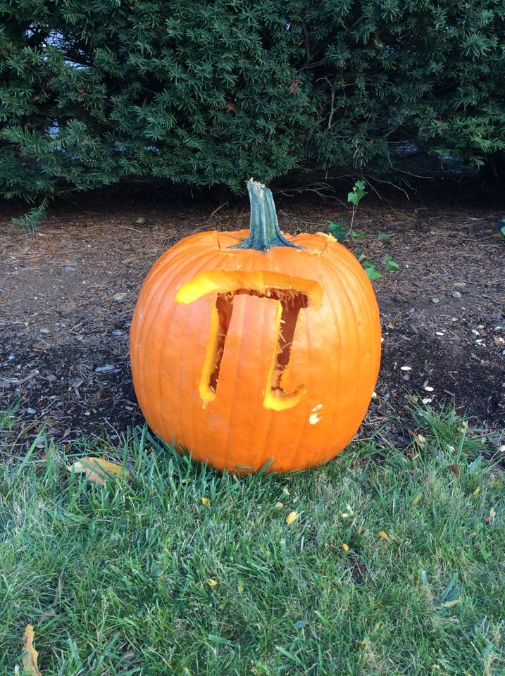 A pumpkin with a Pi symbol carved into it for Pi day