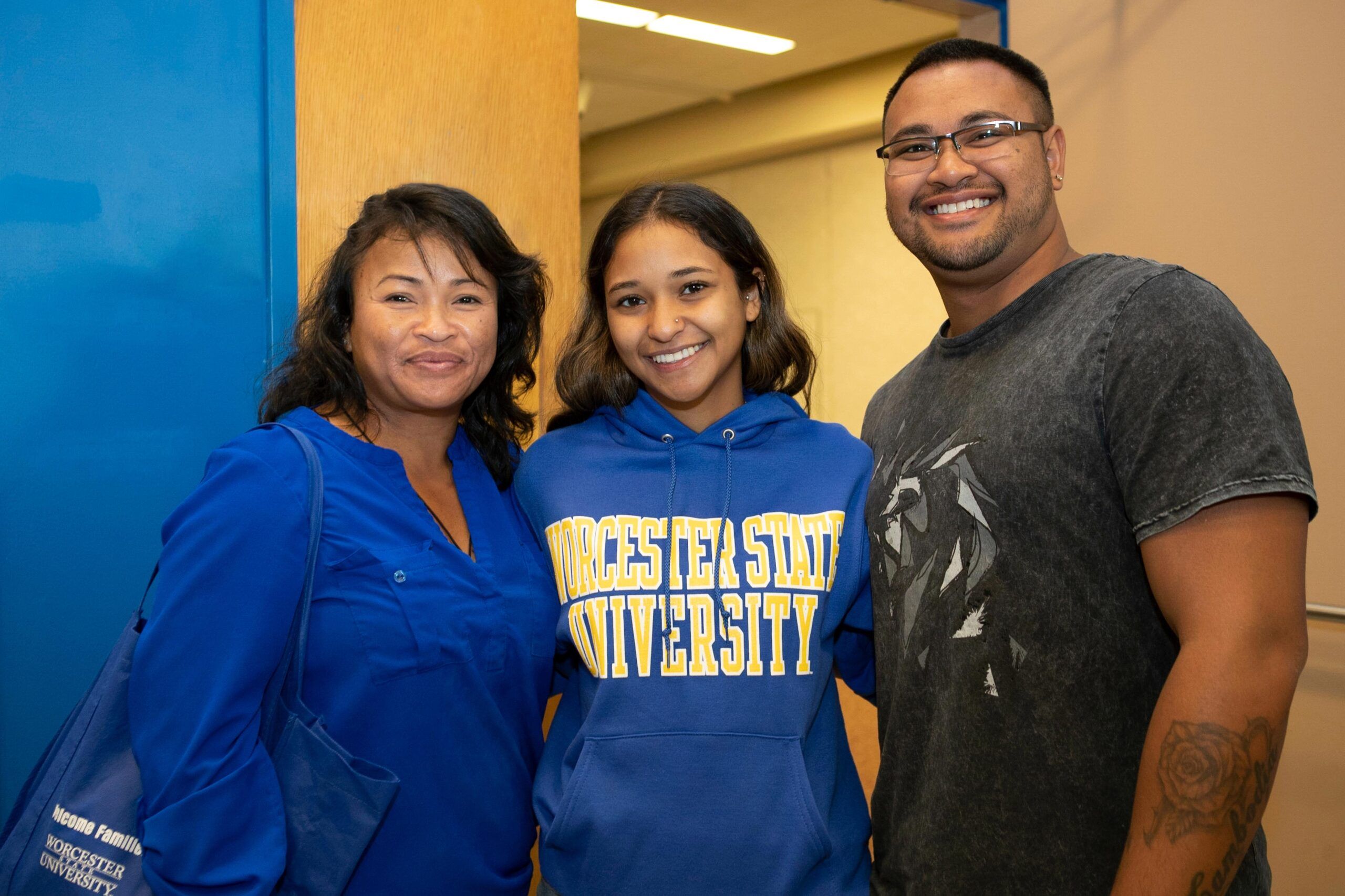 A family posing for a picture, smiling