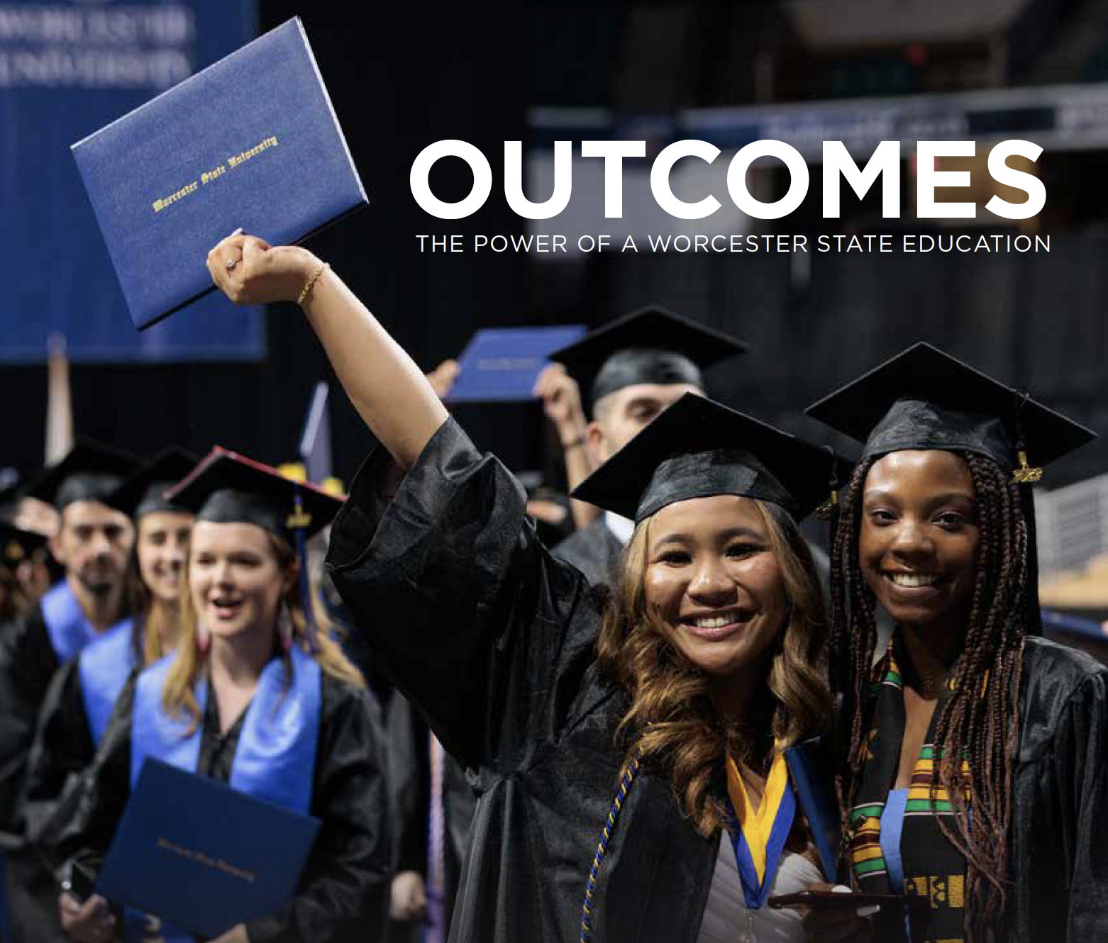 Graduates in caps and gowns celebrate, holding diplomas aloft, under the text "Outcomes: The Power of a Worcester State Education.